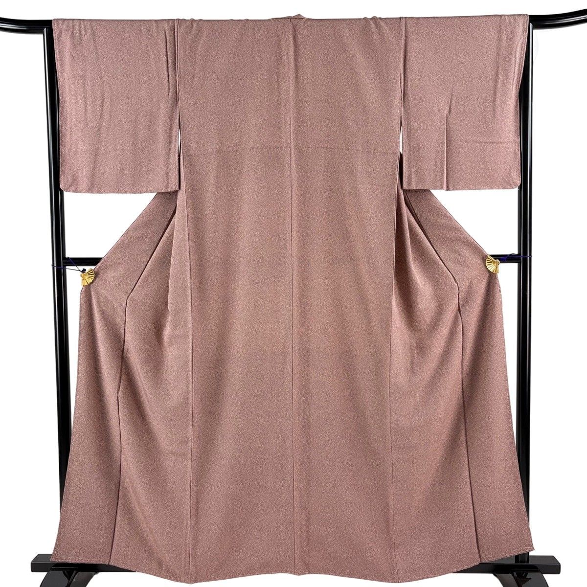 A women's silk Edo komon kimono in azuki color displayed on a kimono stand.