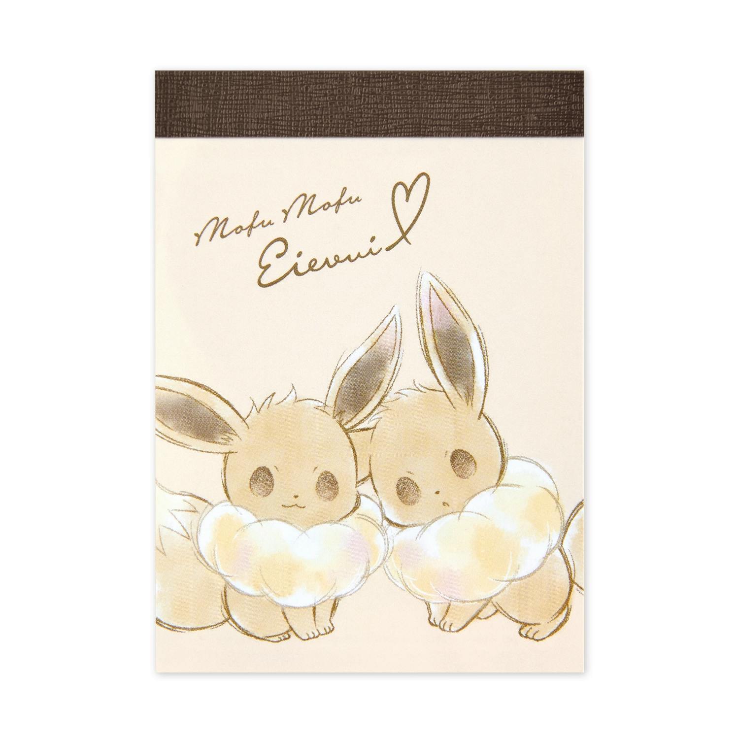 Front cover of an Eevee mini memo pad showing two illustrated Eevee characters and handwritten-style text.
