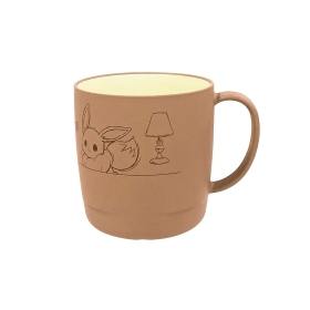 Brown ceramic mug with an Eevee line drawing and a lamp illustration, yellow interior, and a handle on the right.