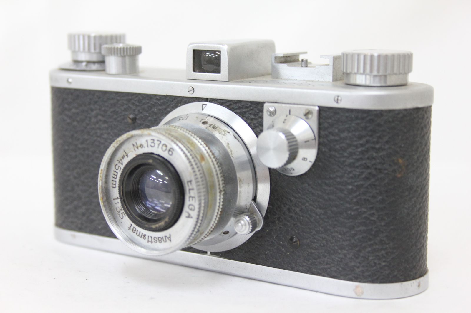 Front three-quarter view of the Elega 35 Anastigmat 45mm F3.5 rangefinder 35mm film camera on a white background.