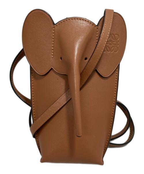 Brown cow leather bag shaped like an elephant with a long trunk, rounded ears, and a shoulder strap.