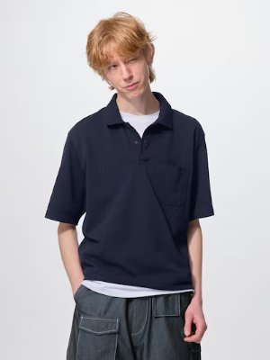 Model wearing a dark dry kanoko polo shirt (5分袖) with a chest pocket.