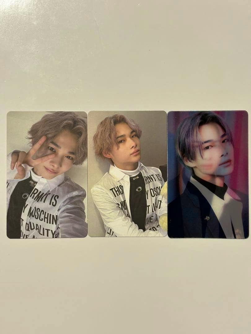 Three ENHYPEN ニキ BORDER:CARNIVAL photocard fronts laid side-by-side on a white background.