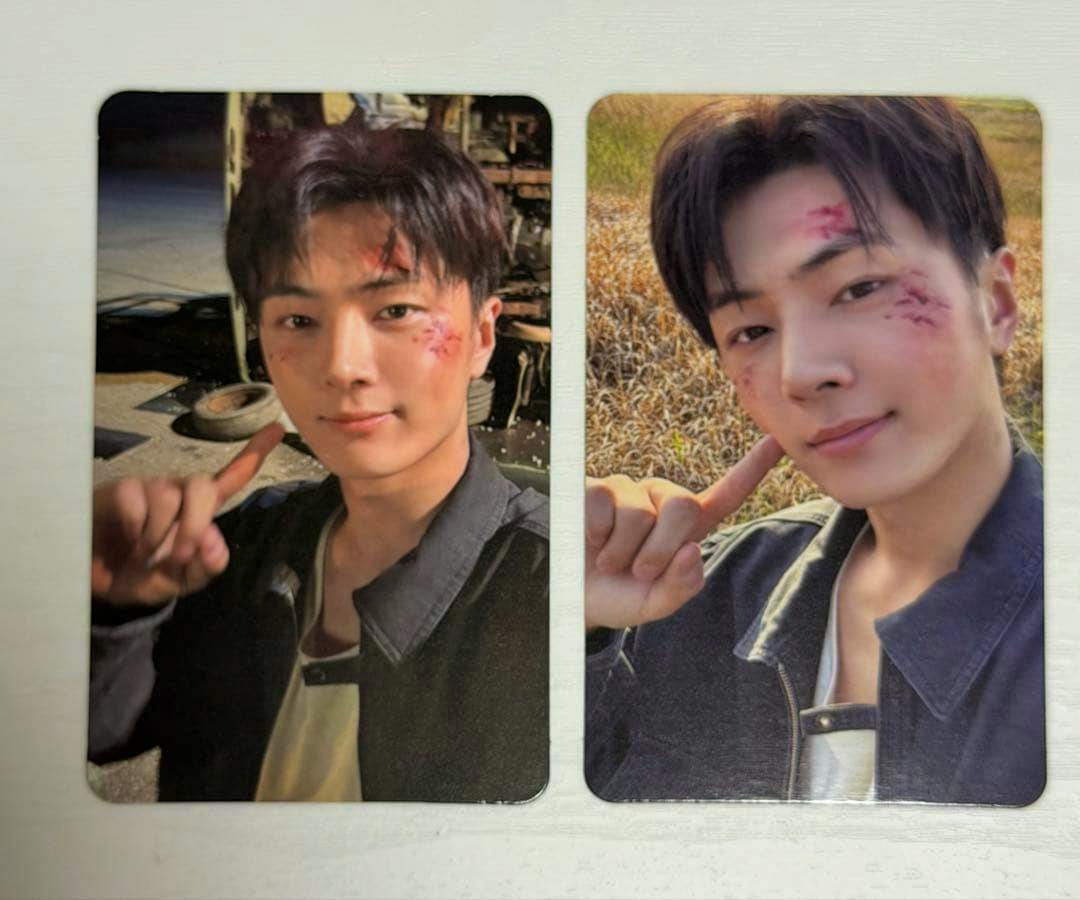 Two photocards from ENHYPEN THE SIN:BLISS showing a person pointing at their cheek with staged facial scratches.