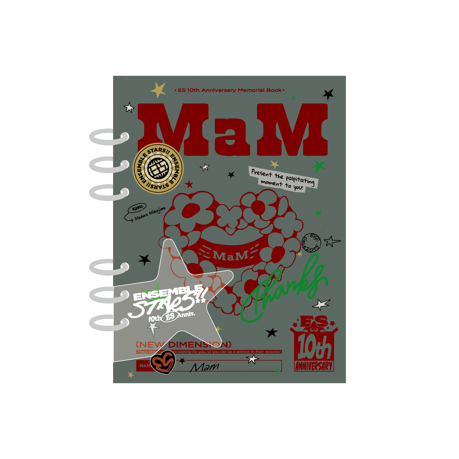 Front cover of the MaM photo album book showing a spiral-bound gray cover with large red "MaM" text, a heart graphic with floral elements, and anniversary badges.