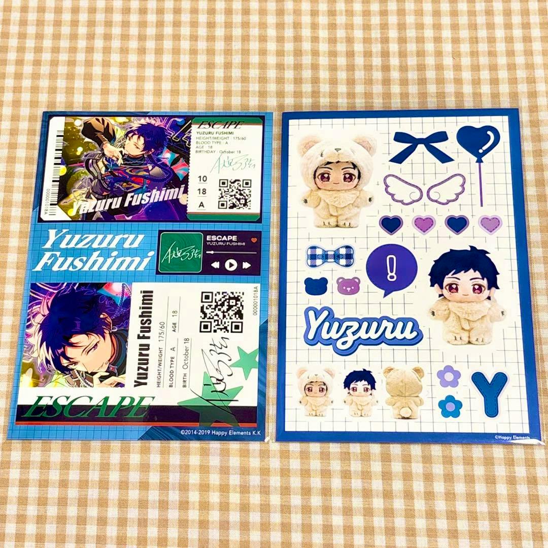 Two sticker/bromide sheets for Yuzuru Fushimi showing character illustrations and plush chibi stickers on a checkered background.