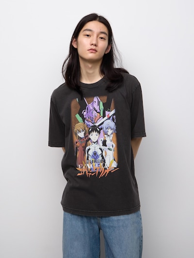 Model wearing a washed black cotton EVANGELION graphic T-shirt showing character artwork on the front.