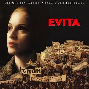 Front cover artwork for the Evita soundtrack showing a woman's face on the left, a crowd holding banners, and the title "EVITA" in red.