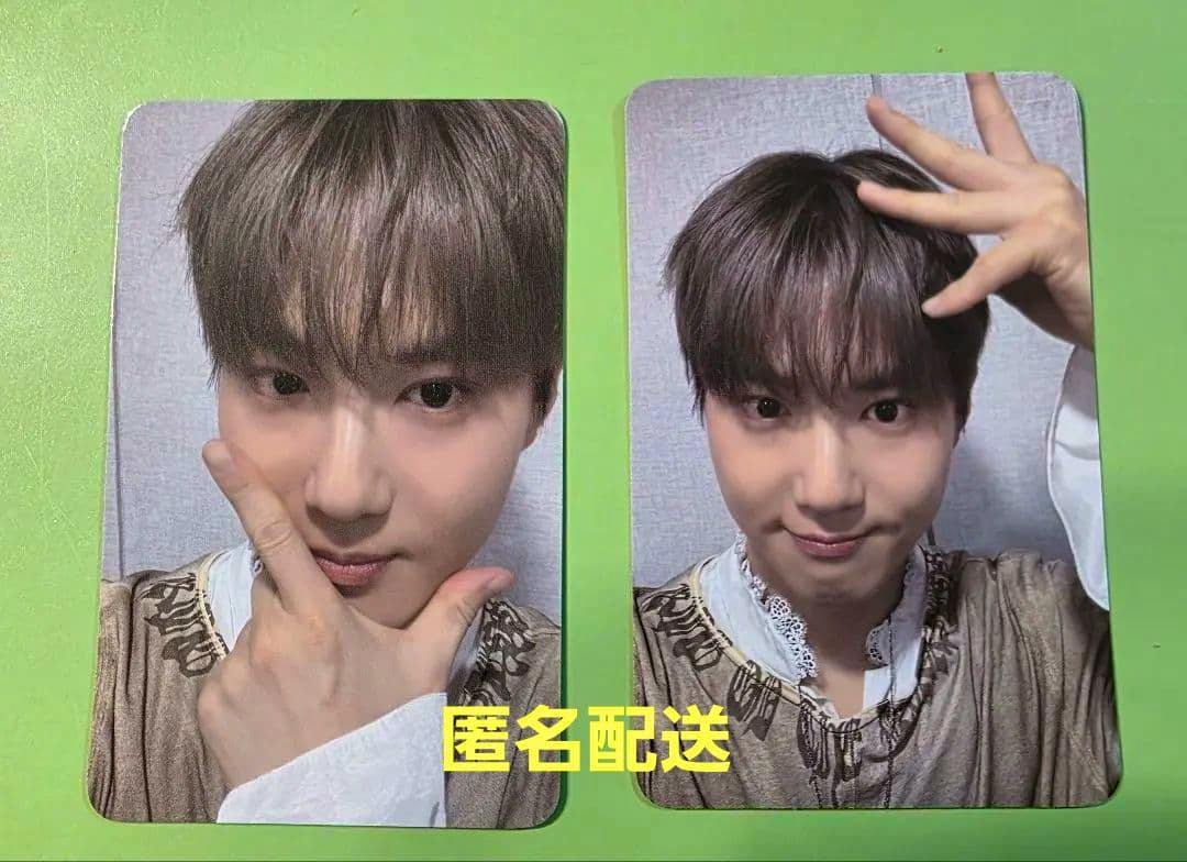 Two EXO Suho photocard fronts showing his portrait poses on a green background.