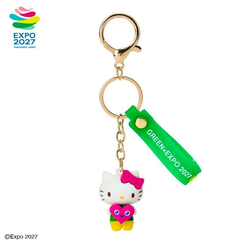 Front view of the EXPO2027 Sanrio Characters 3D keychain showing the white Sanrio character holding a pink heart, with a green EXPO strap and gold keyring.