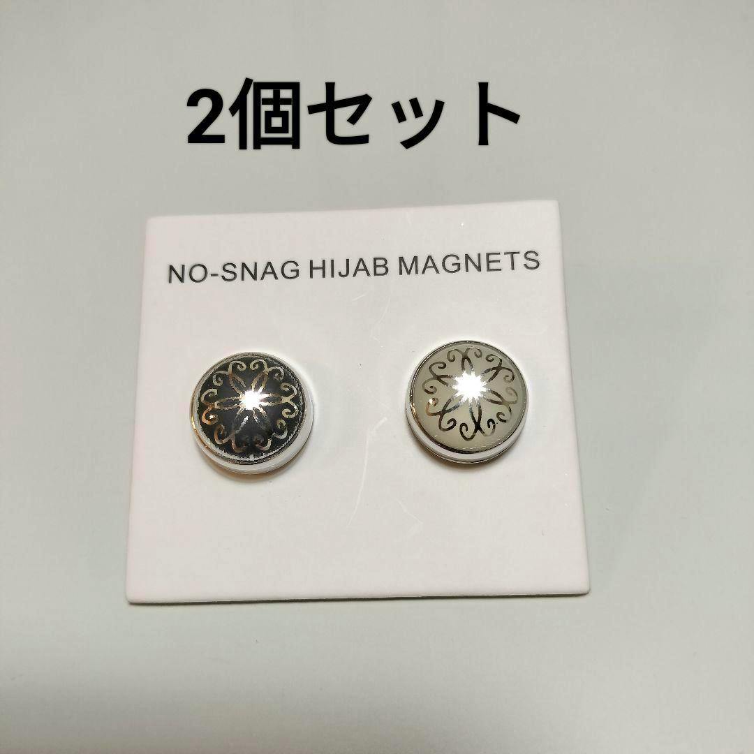 Two round hijab magnetic pins (one dark, one light) displayed on a white card labeled "NO-SNAG HIJAB MAGNETS."