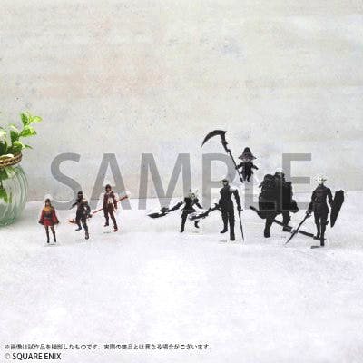 Several small acrylic character stand figures from the mini acrylic figure collection arranged on a white surface.