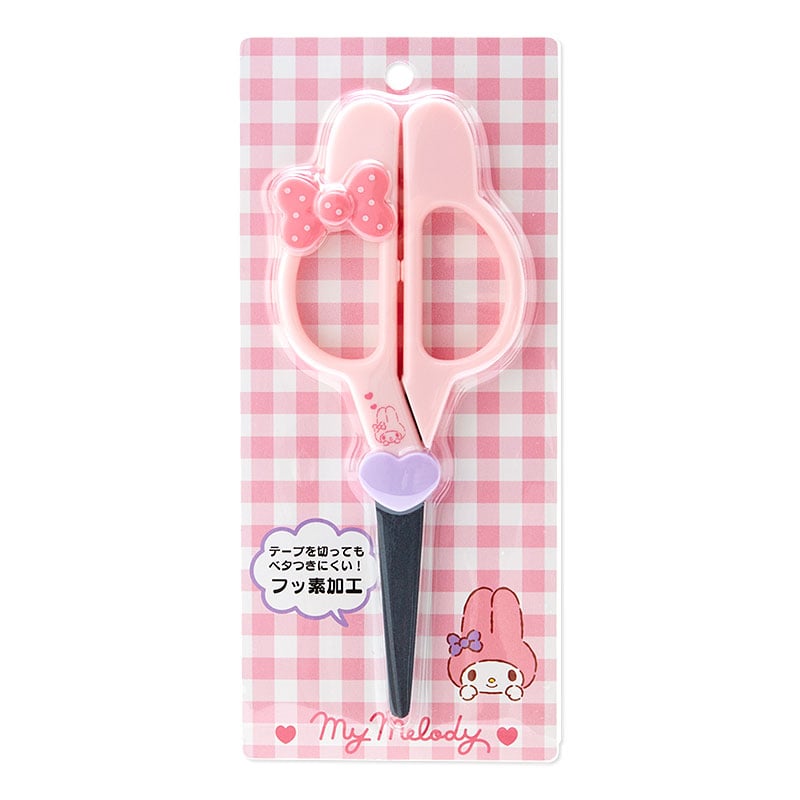 Pink face-shaped scissors in blister packaging on a pink checkered backing featuring a My Melody illustration.