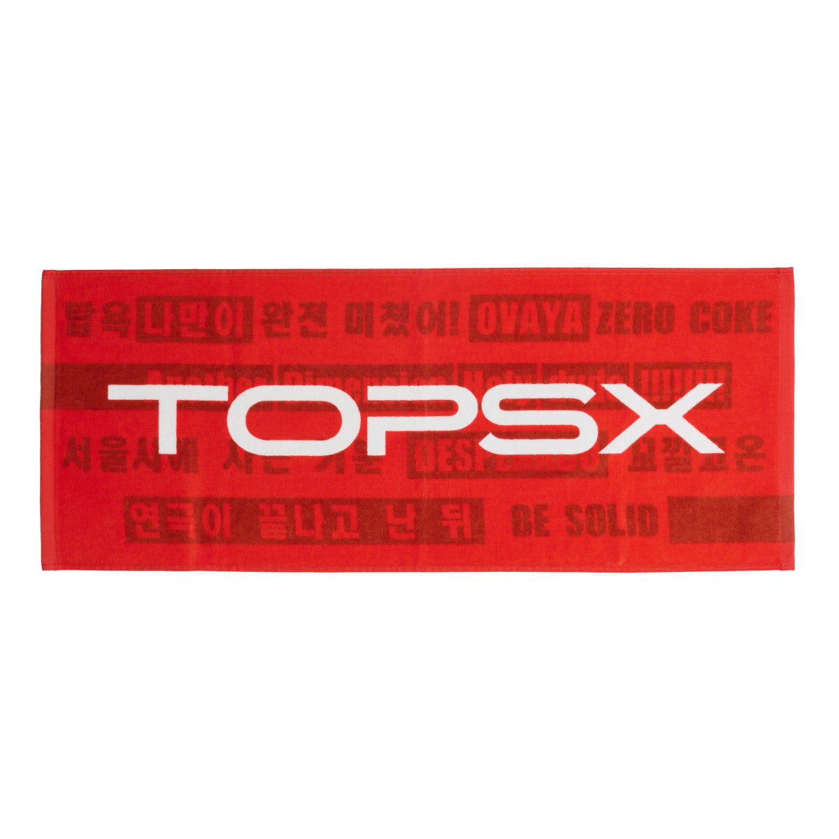 Red cotton face towel showing a large white 'TOPSX' logo across the center and darker red background text.