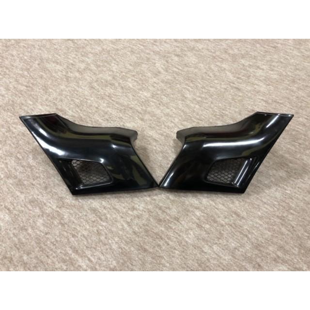 Two black FADSTAR side cowling pieces shown on a carpeted surface.