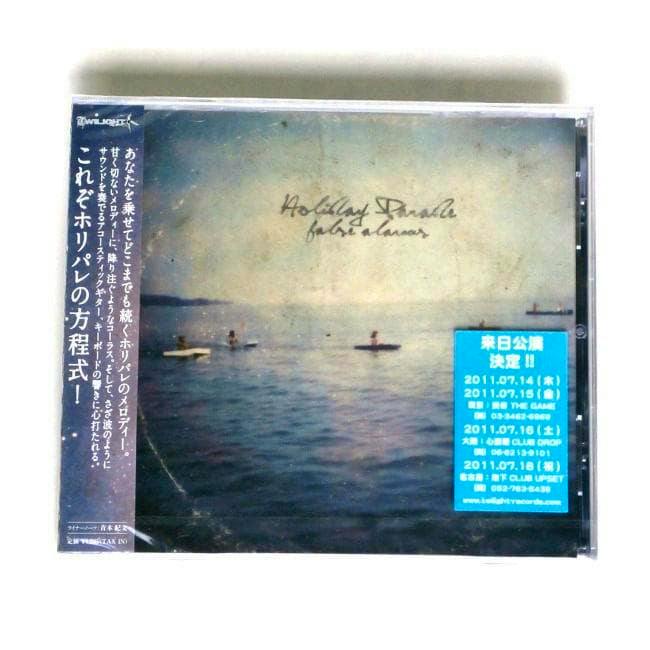 Front of the HOLIDAY PARADE CD jewel case showing the album cover art and a Japanese obi strip.