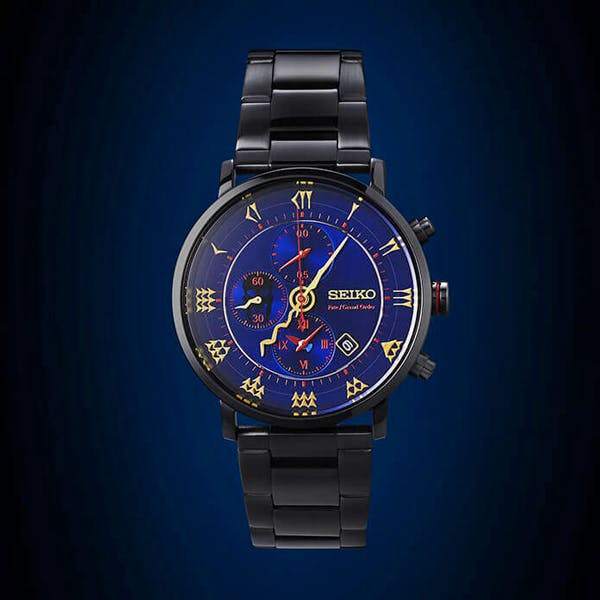 Front view of the Fate/Grand Order Lancer/Ereshkigal model wristwatch with a blue dial, gold markings, and a black metal bracelet.
