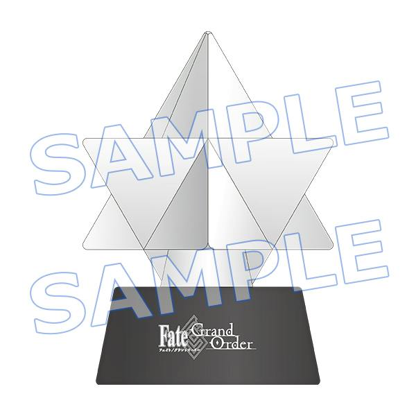 Render of the 聖晶石ルームライト LED table lamp showing a faceted crystal-shaped light on a rectangular base with the Fate/Grand Order logo.
