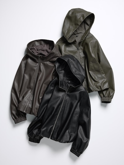 Three synthetic-leather women's balloon-hem hooded jackets (parkas) in different colors laid flat on a white background.