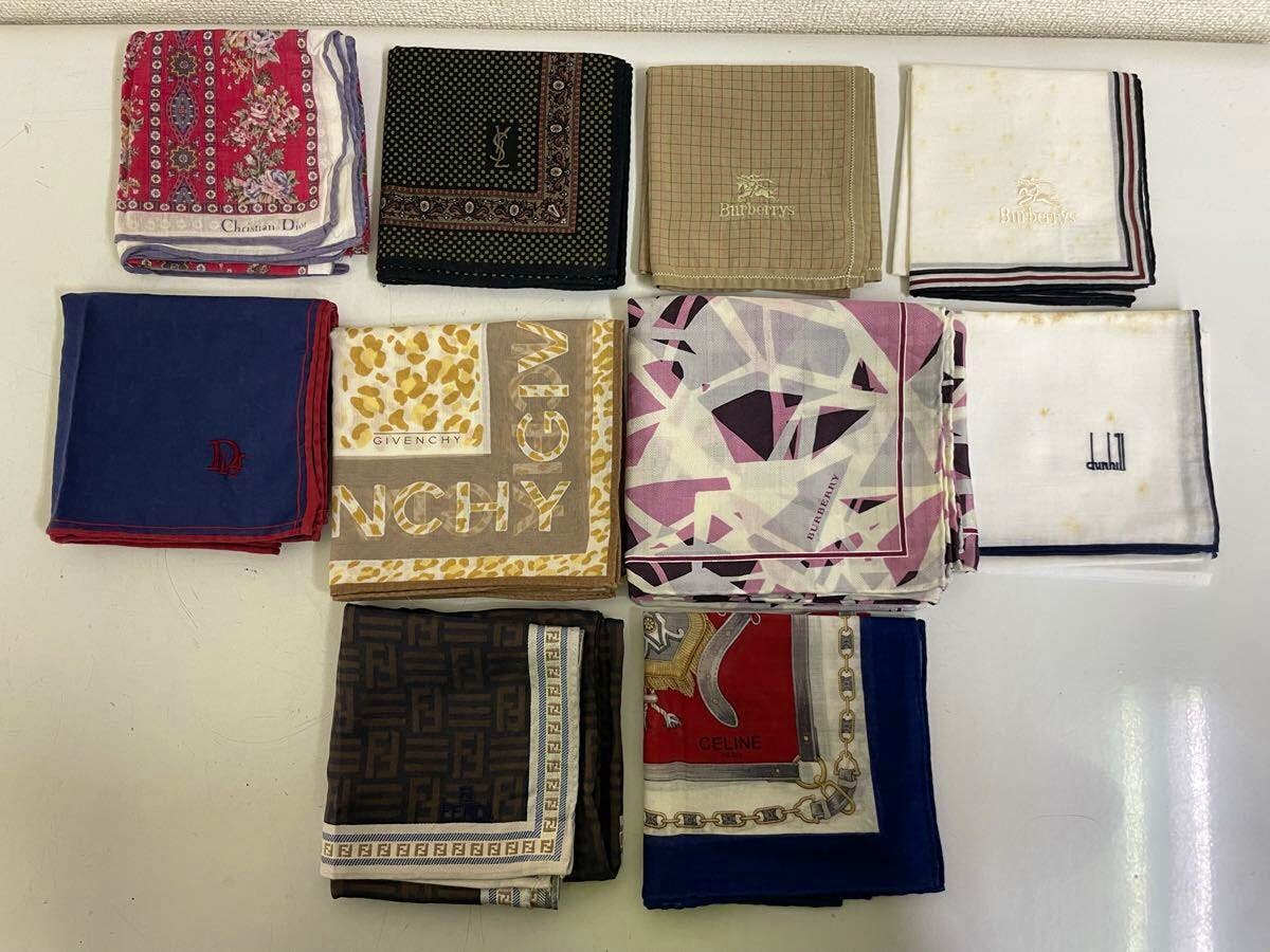 Ten folded handkerchiefs from a bulk set arranged on a flat surface showing various patterns and brand logos.