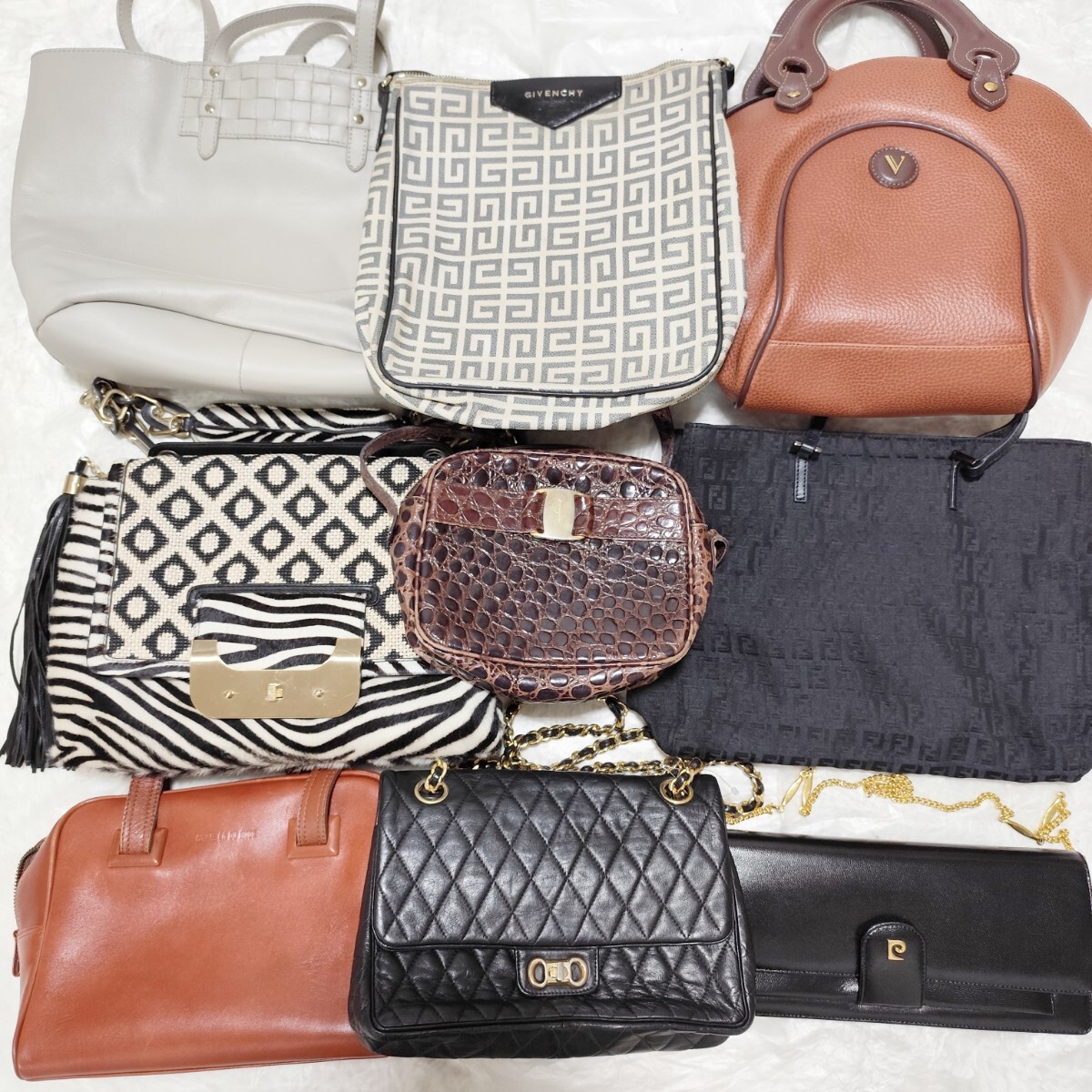 A set of nine assorted bags arranged together on a white surface.