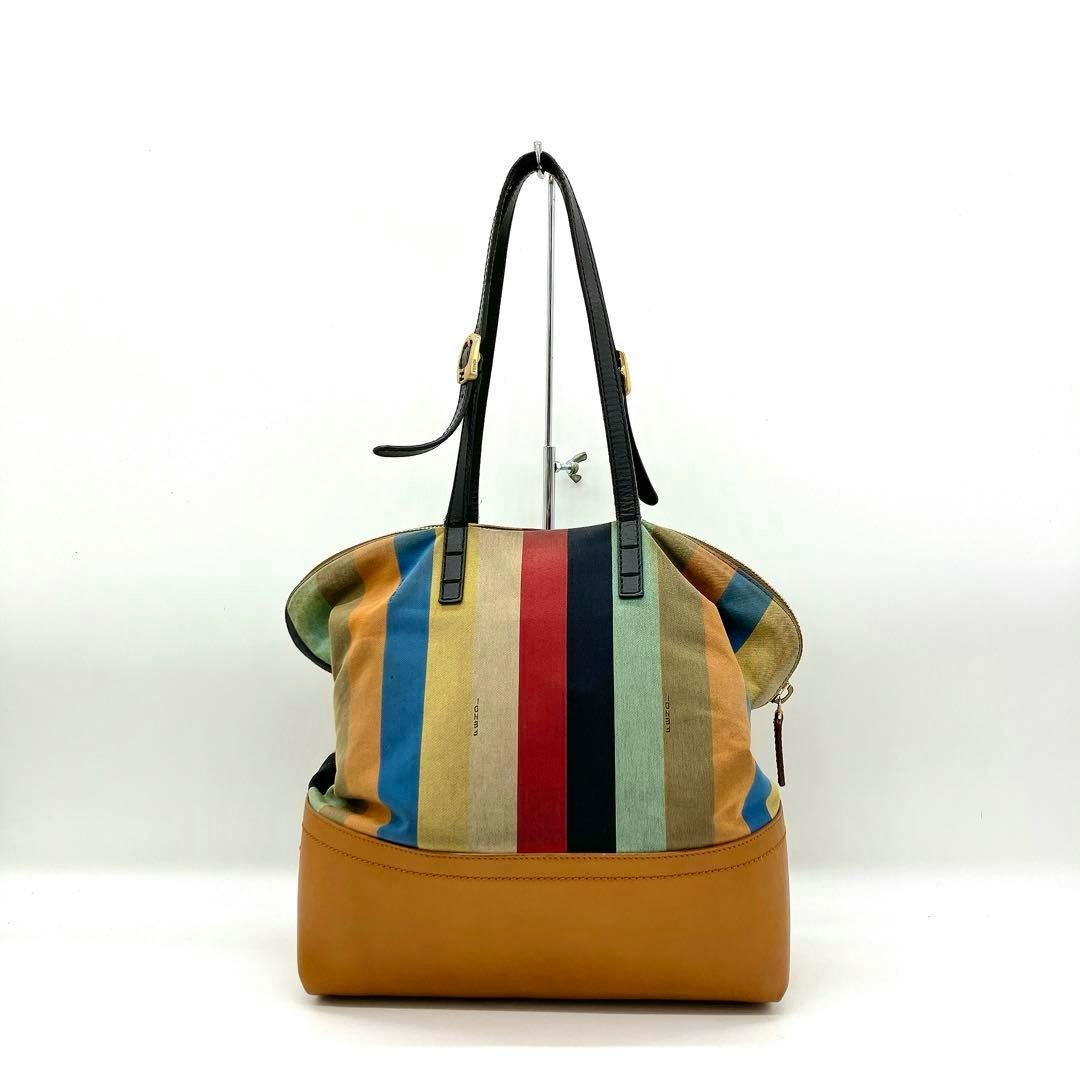 FENDI multicolor vertical striped tote bag with black shoulder straps and tan leather base shown front-facing on a white background.