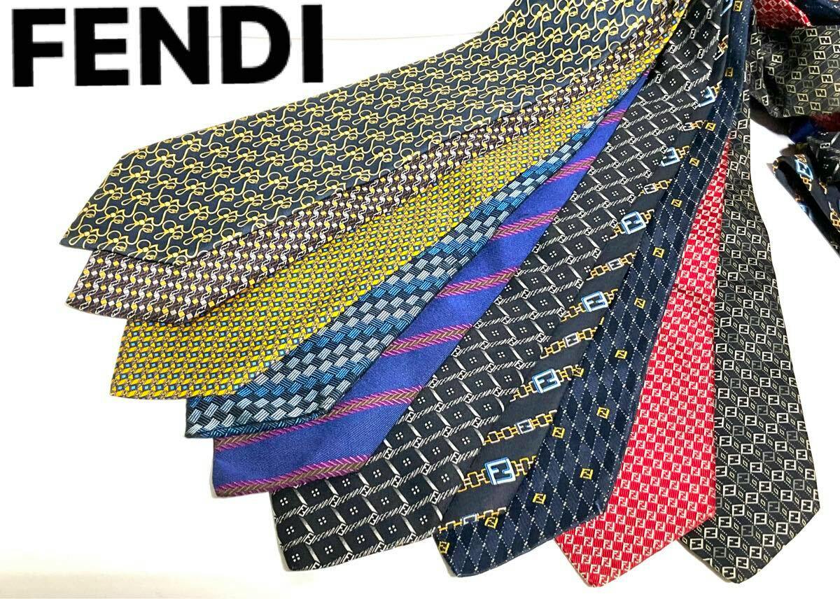 Fanned set of FENDI silk neckties with assorted patterns, shown with a FENDI logo at top left.
