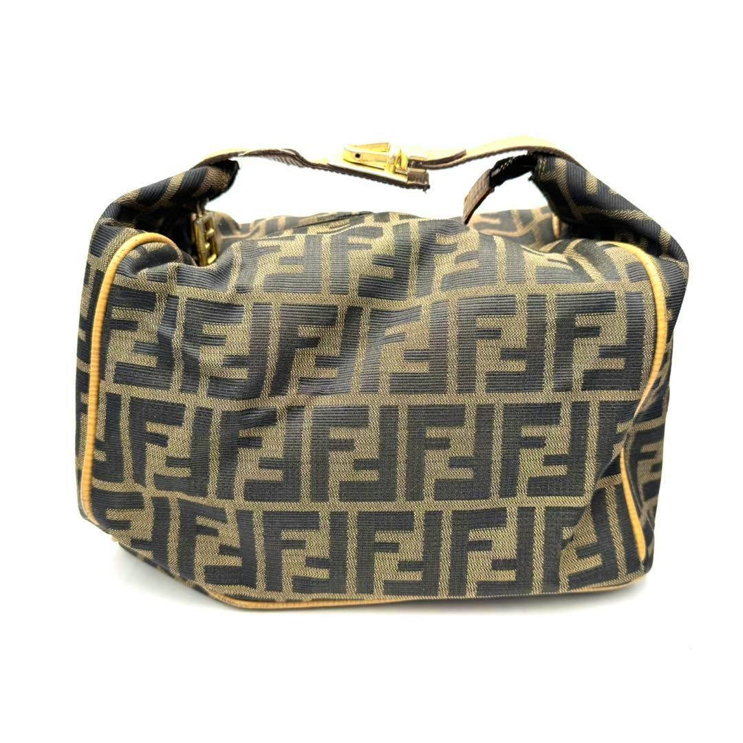 Front view of a Fendi Zucca canvas and leather vanity handbag showing the all-over FF monogram and leather piping.