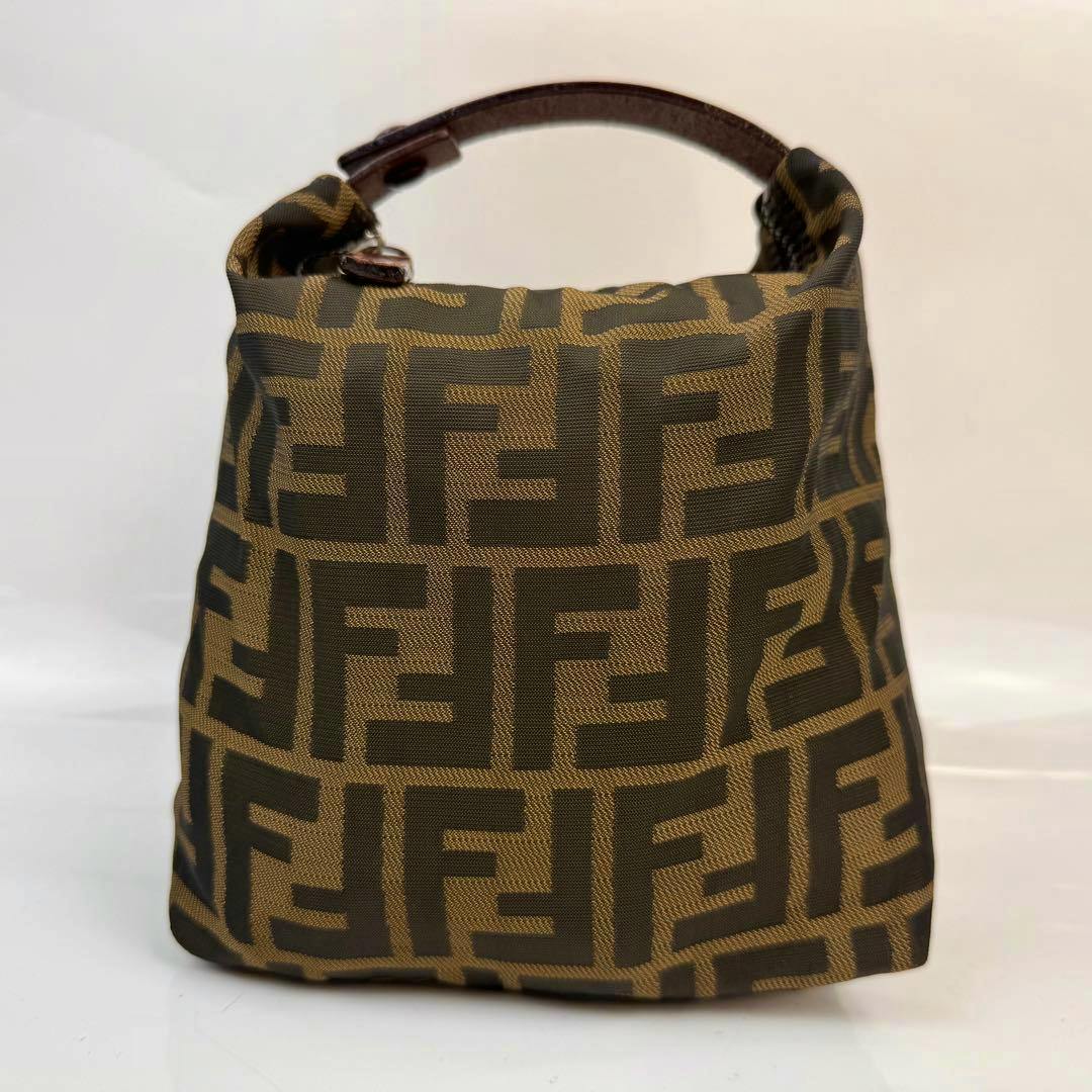 Front view of the FENDI Zucca mini accessory pouch handbag with top handle.