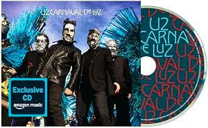 CD front cover artwork showing four people in front of blue feathered decorations alongside the CD disc artwork with repeated "CARNAVAL DE LUZ" text.