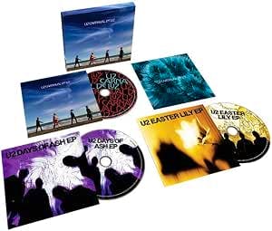 Photo of the deluxe CD set laid out, showing three discs, inner sleeves, and the outer box.