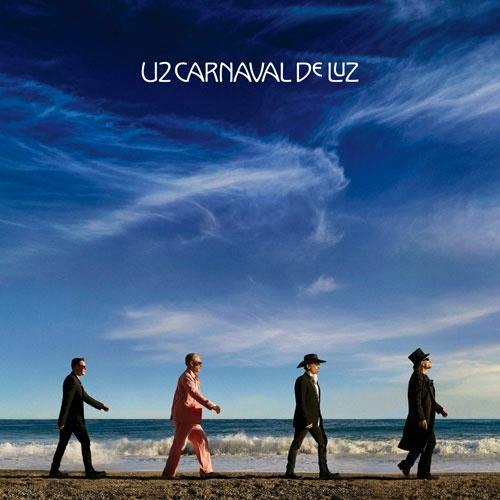 Vinyl record cover art showing four people walking along a shoreline under a blue sky with the album title at the top.