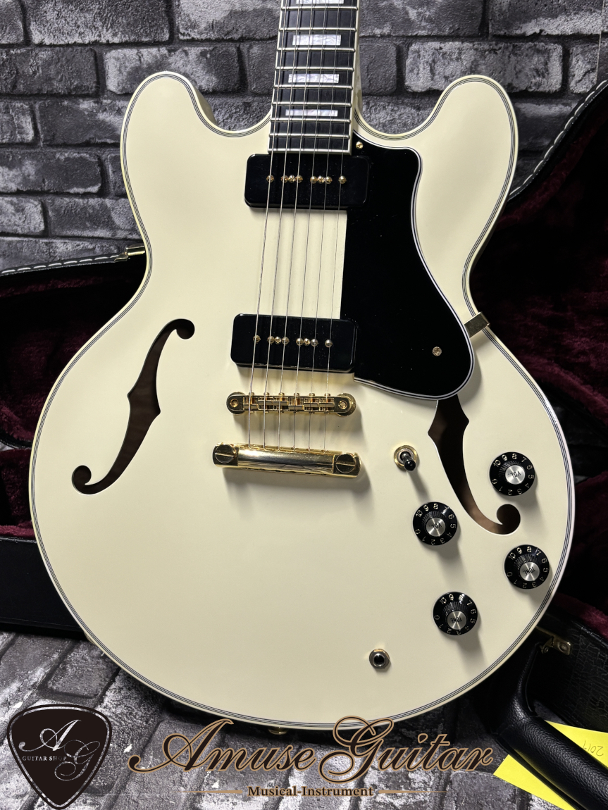 Front of an antique white FUJIGEN Masterfield guitar showing two pickups, bridge, f-holes, black pickguard, and control knobs.