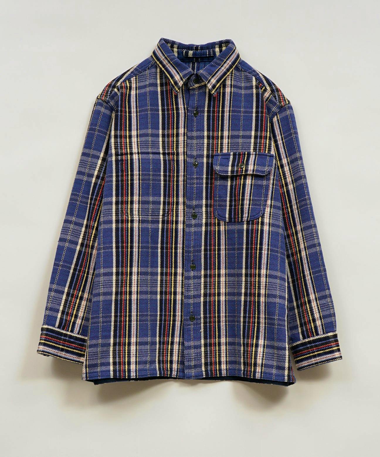 Front view of a men's blue plaid field shirt with button front and a single chest flap pocket.