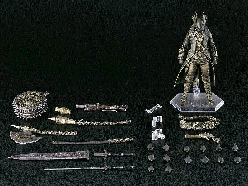 figma 狩人 The Old Hunters Edition figure and its accessories laid out on a black background.