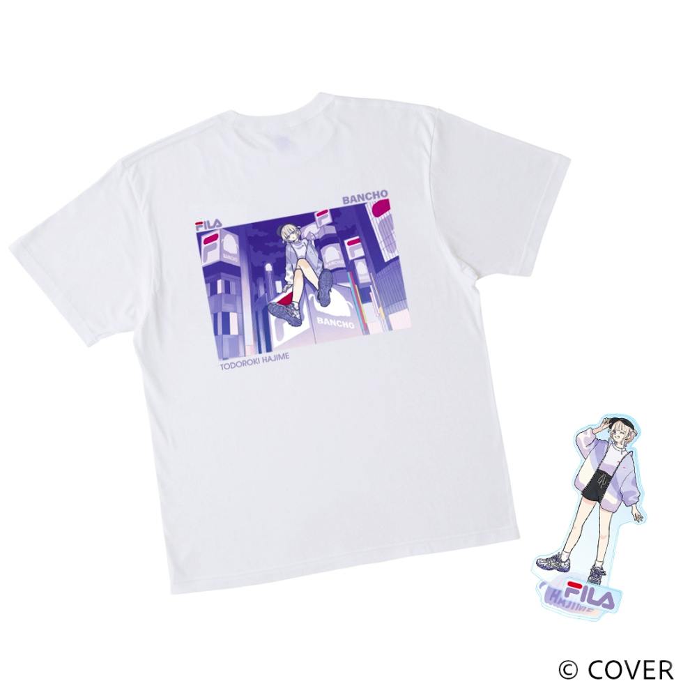 White FILA × TODOROKI HAJIME cotton T-shirt laid flat showing the back graphic print with the acrylic stand beside it.