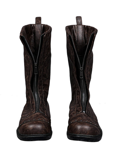 Front view of a pair of brown leather boots with front zippers on a white background.