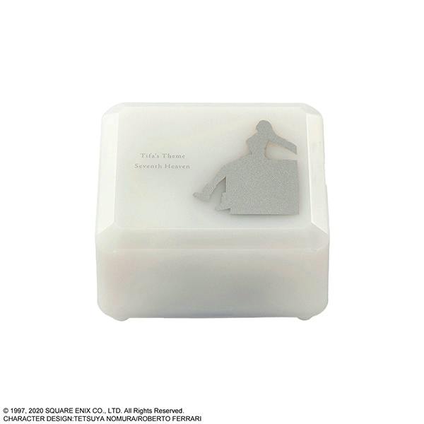 White rectangular music box with a silver silhouette of a seated figure and the words "Tifa's Theme Seventh Heaven" on the top.