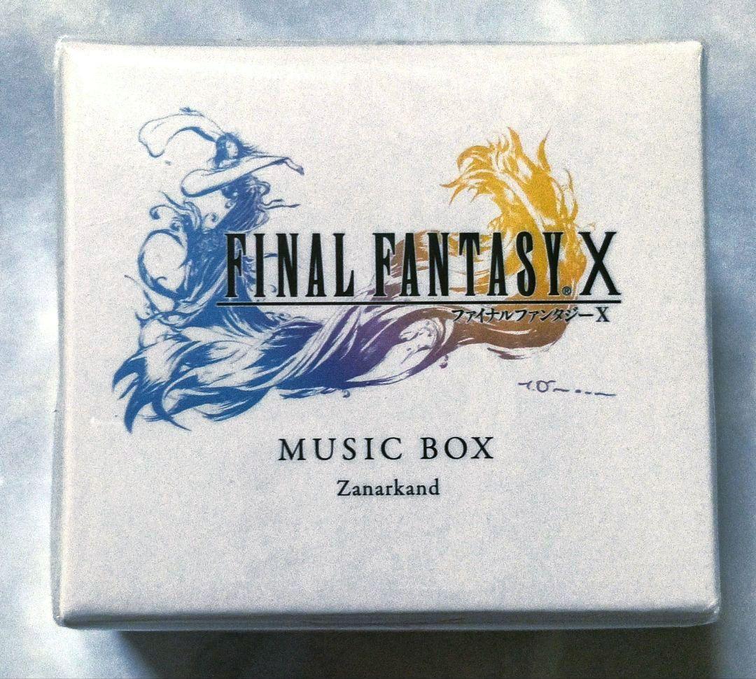 A square white box showing the FINAL FANTASY X music box packaging labeled "Zanarkand."