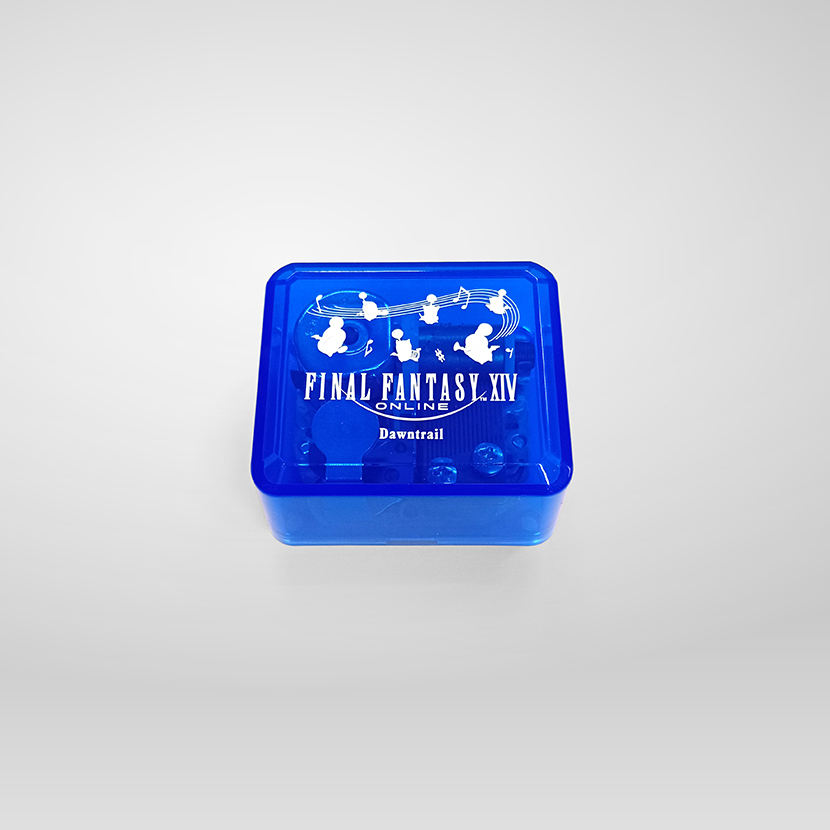 Blue translucent square music box with FINAL FANTASY XIV and Dawntrail printed on its lid.