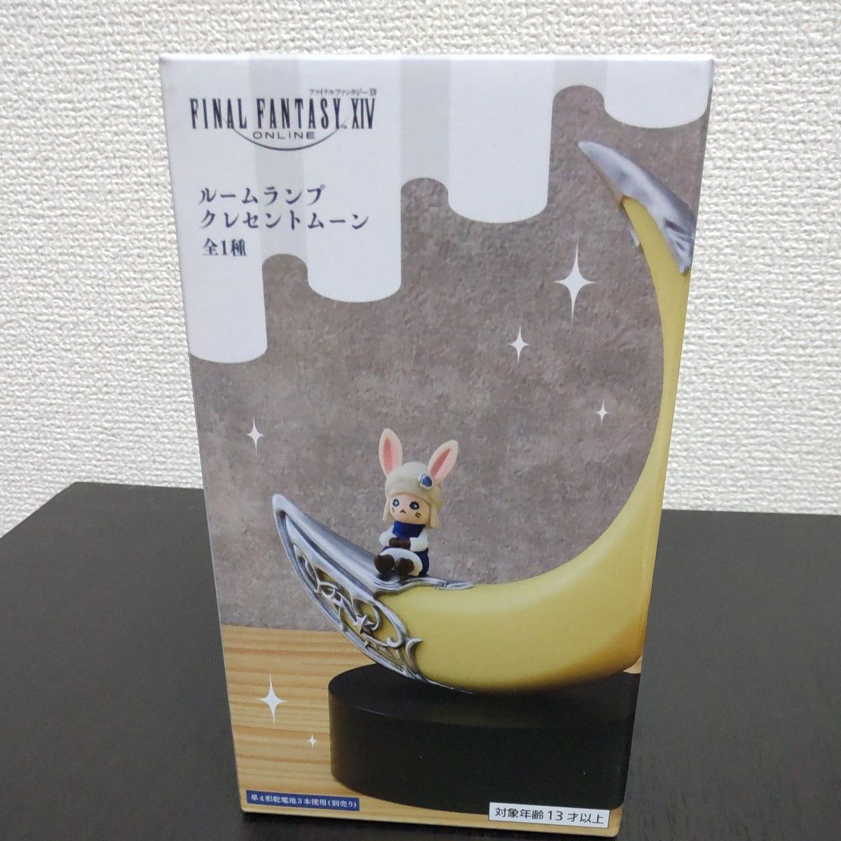 Retail box for XIV Moonlight showing a crescent-moon desk lamp on a black base with a small rabbit figurine.