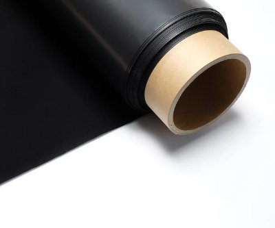 A rolled black sheet material on a cardboard core against a white background.