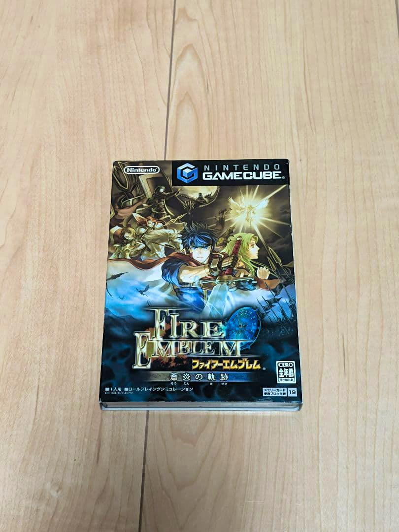 Front of the Nintendo GameCube box for Fire Emblem: 蒼炎の軌跡 placed on a wooden floor.