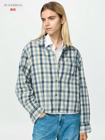 Model wearing the flannel boxy shirt in a blue-and-white check pattern paired with jeans.