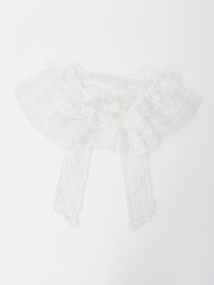 White lace cape laid flat on a white background.