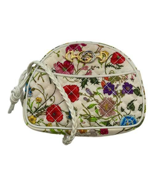 Off-white floral canvas mini shoulder bag with braided strap and gold-tone hardware.