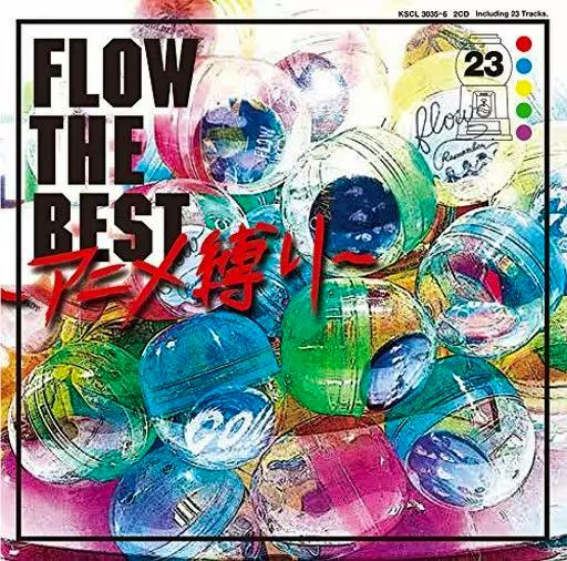 Front cover art of the FLOW CD "FLOW THE BEST ～アニメ縛り～" showing colorful translucent capsule toy balls and bold title text.