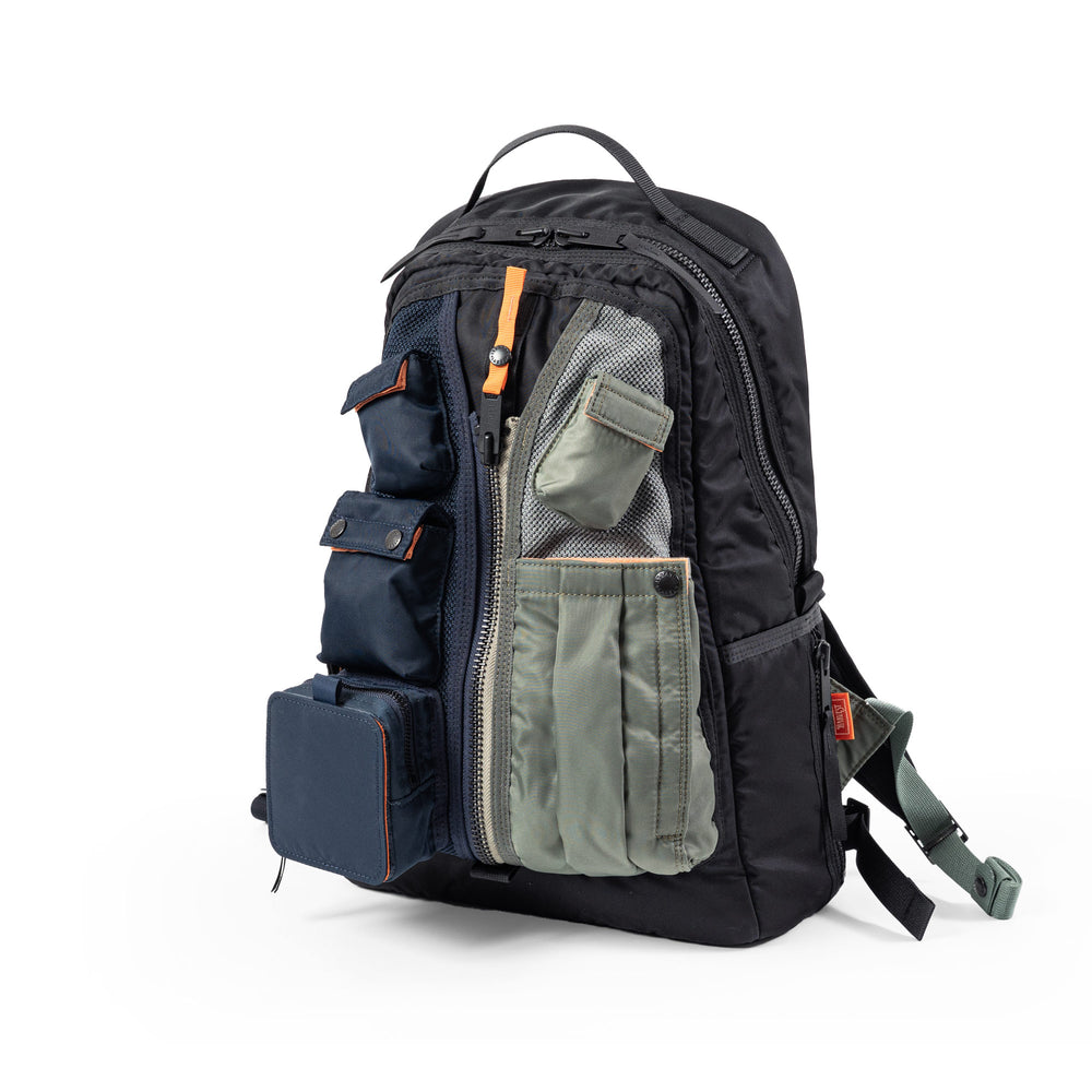 A FLYER'S 70XX MIX PRO-SPEC backpack shown at an angle with multiple external pouches and a top handle.