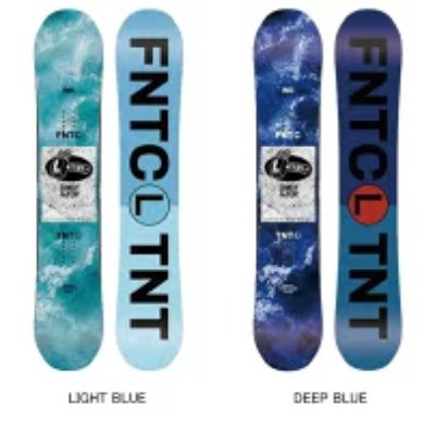 Two snowboards side-by-side, one light blue and one deep blue, each showing large vertical FNTCL TNT text.