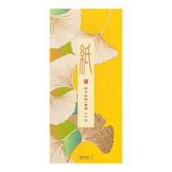 Front view of a yellow letter set package decorated with stylized ginkgo leaves and a vertical Japanese label.